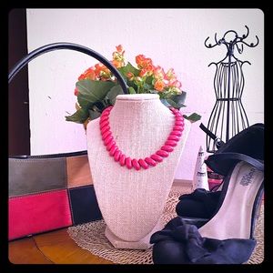 Wedge  heels, red necklace with mini bag.